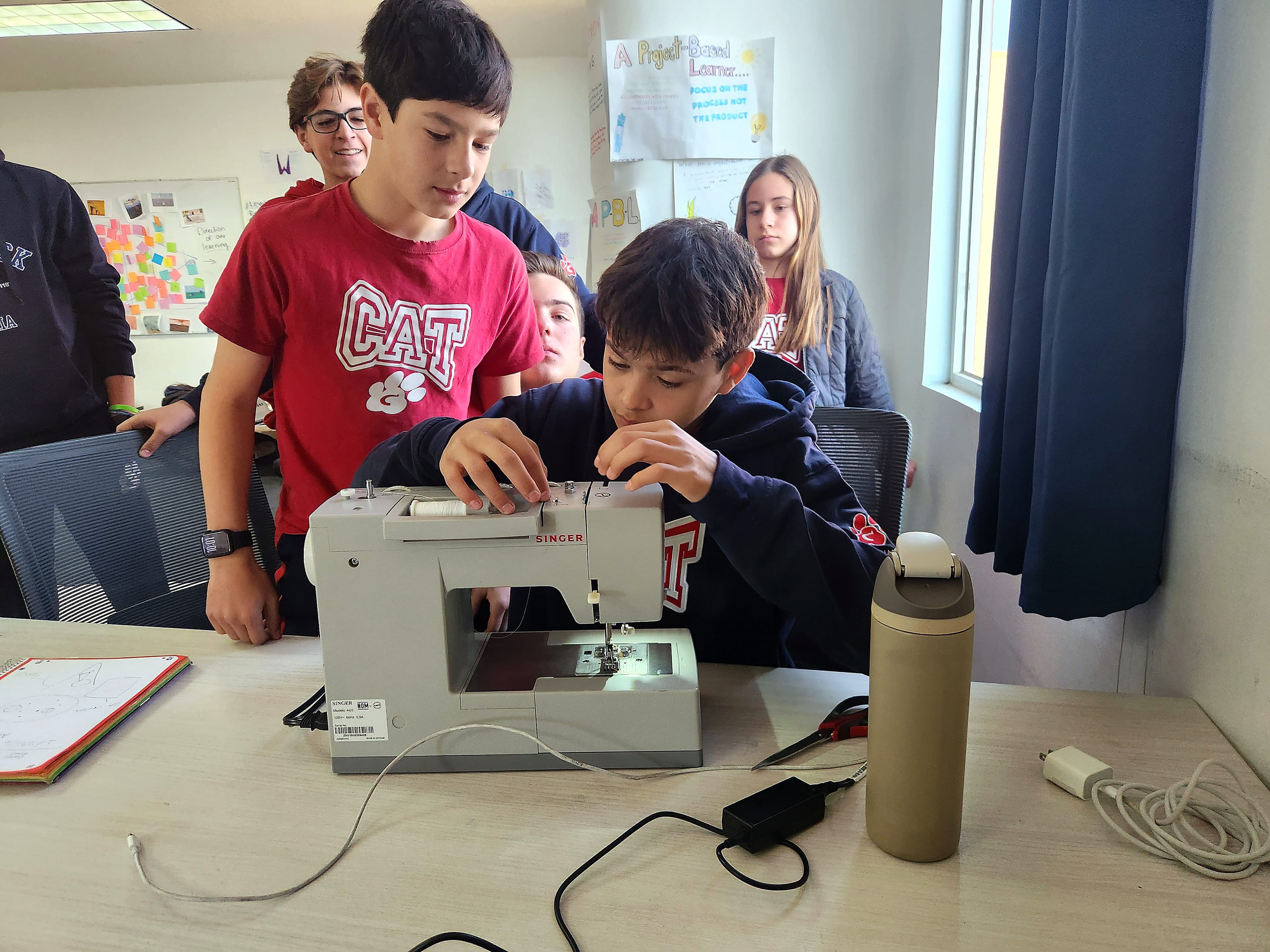 Students building a prototype together